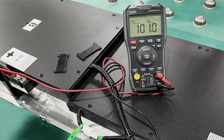 Technician installing EV battery upgrade kit